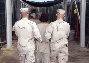 800px-Captive_being_escorted_for_medical_care,_December_2007