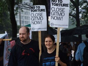 Two protesters, photo by Joshua Sherurcij